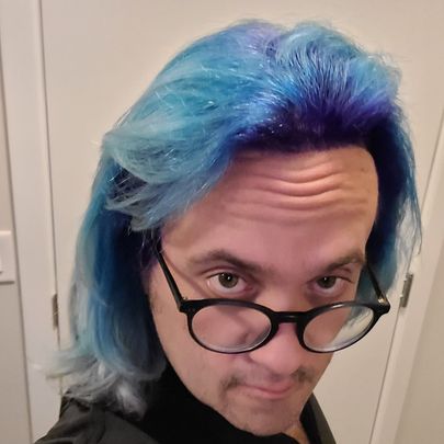 Headshot of Phoenix Ehmann with blue and purple hair